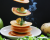 Blinis de pommes de terre à la roquette et flétan fumé par Jean-Sébastien Bompoi