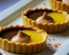 Tartelettes sablées et soufflé au chocolat, quenelles mousseuses et coulis de mangue