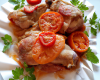 Cuisses de lapin en papillote de lard et aux tomates