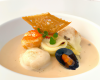 Ravioles de Saint-Jacques et julienne de légumes, bisque de langoustines au foie gras et truffes