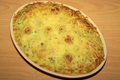 Gratin de ravioles aux lardons et courgette