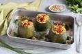 Courgettes farcies au couscous, quinoa noir et graines de lin