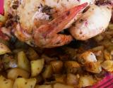 Poulet au four aux herbes sur lit de pommes de terre
