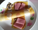 Crêpes roulées aux champignons et jambon