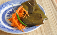 Filet de poisson en papillotes de feuilles de bananier