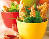 De fines lamelles de poulet panées aux amandes accompagnées de jeunes pousses d'épinards. Une recette qui plaira à vos enfants, ils adoreront…