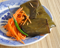 Filet de poisson en papillotes de feuilles de bananier