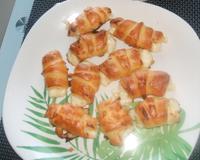 Mini feuilleté en forme de croissant, idéal pour l'apéritif.