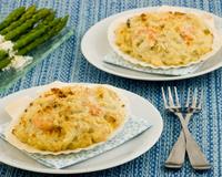 Un gratin de noix de Saint Jacques au fromage à la crème Elle & Vire qui fera plaisir aux passionnés de la mer.