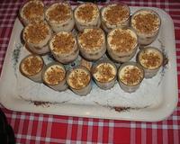 Superposer le spéculos, les pommes au caramel et le mascarpone au chocolat blanc dans un verre. Saupoudrer de noisettes grillées