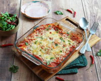 Besoin d’une idée pour le dîner ? Essayez ces enchiladas au rôti de porc à la sauce tomate épicée