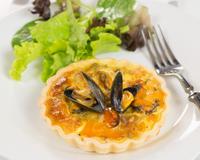 Une tarte gourmande qui allie potimarron et moules. 