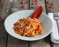 Trofie en sauce bisque de homard, homard et grenade