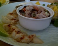 Risotto de fruits de mer, fonds d'artichauts mimosa, carpaccio de Saint-Jacques au piment doux citron vert