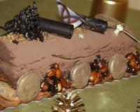 Cette bûche est une adaptation du fameux trianon ou royal au chocolat, elle est composée de trois couche, une mousse au chocolat, un croquant chocolat praliné…