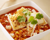 Risotto de blanc de seiche, jus de tomate et Pouligny Saint-Pierre, huile vierge de coriandre et amandes grillées