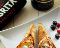 Des cornets de crêpes gourmands pour la chandeleur ! Délicieusement garni d'une chantilly nappée d'un caramel au café et rhum Négrita.Une recette proposée par Cécile…