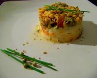 Parmentier de truite du Jura cuite en papillote à la provencale sur écrasé de légumes du jardin.