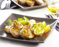 Filet mignon de porc caramélisé à l'arôme, courgettes confites et zestes d'orange