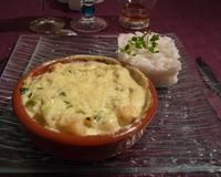 Recette de gratin de pétoncles, avec sa fondue de poireaux au curry.