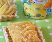 Ces tartelettes à l'ananas St Mamet sont fondantes et juteuses. Le pralin apporte une touche en plus.