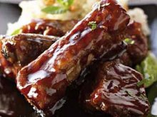 Travers de porc caramélisés, sauce au gingembre et risotto aux amandes