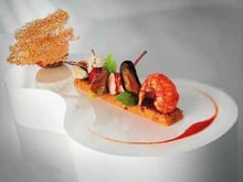 Compression d'une paella : lapin, volaille, chorizo, moule, coque, homard, calmar, langoustine