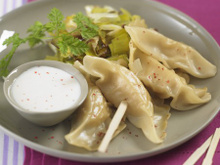 Ravioles de Saint-Jacques, fondue de poireaux et sauce crémée au Floc de Gascogne blanc