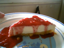 Cheesecake ricotta-mascarpone, coulis de fraises des bois & framboises