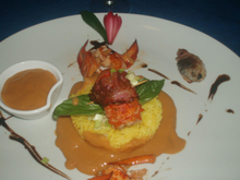 Rôti de Homard lardé au bacon sur lit de riz safrané