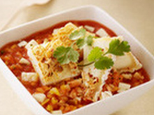 Risotto de blanc de seiche, jus de tomate et Pouligny Saint Pierre, huile vierge de coriandre et amandes grillées