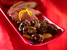 Magret de canard au miel et pruneaux aux amandes