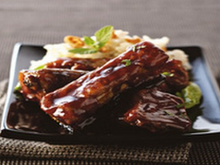 Travers de porc caramélisés sauce au gingembre et risotto aux amandes