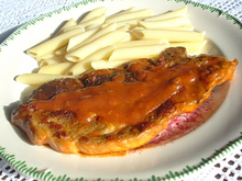 Côte de porc au vin blanc et à la tomate