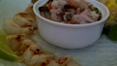 Risotto de fruits de mer, fonds d'artichauts mimosa, carpaccio de Saint-Jacques au piment doux citron vert