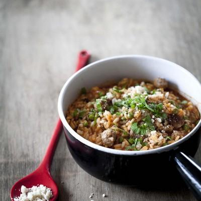 Risotto au Tomacoulis, saucisse et petits pois