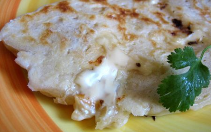 Naan au fromage ou cheese-naan - Photo par ottoki