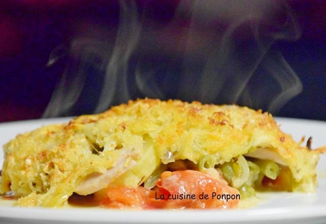 Gratin de pommes de terre, boudin blanc, tomates et haricots